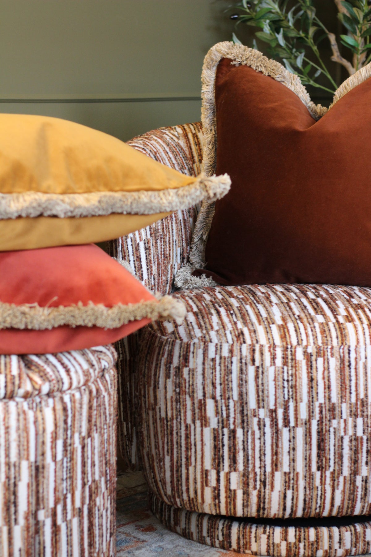 Langford Whiskey fringed velvet cushion in a warm whiskey tone, 55 x 55cm