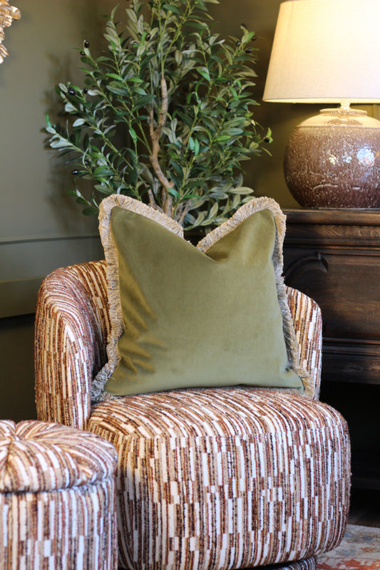 Langford Olive fringed velvet cushion in an earthy olive green, 55 x 55cm