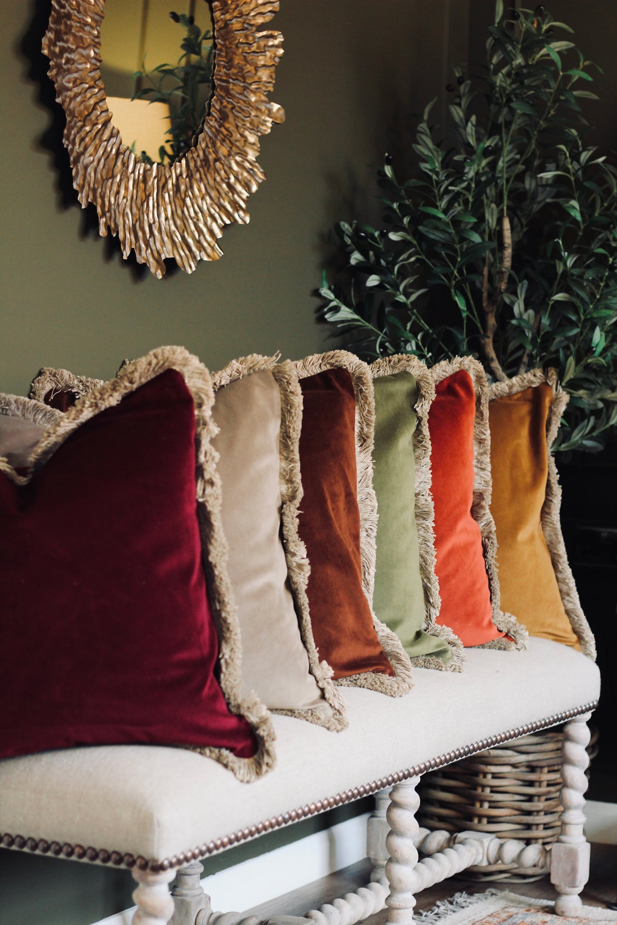 Langford Stone fringed velvet cushion in a warm neutral tone, 55 x 55cm