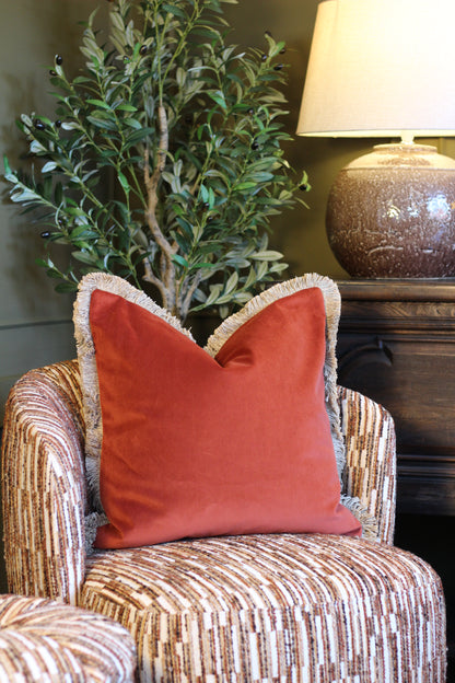 Langford Rust fringed velvet cushion in a warm rust tone, 55 x 55cm