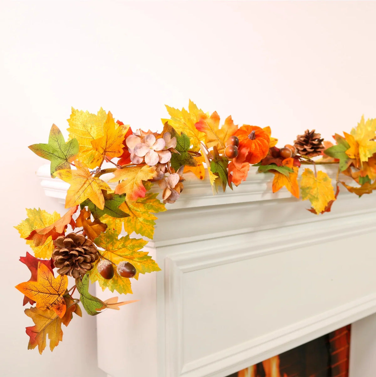 Autumn Glow Garland styled with warm mixed foliage and woodland details