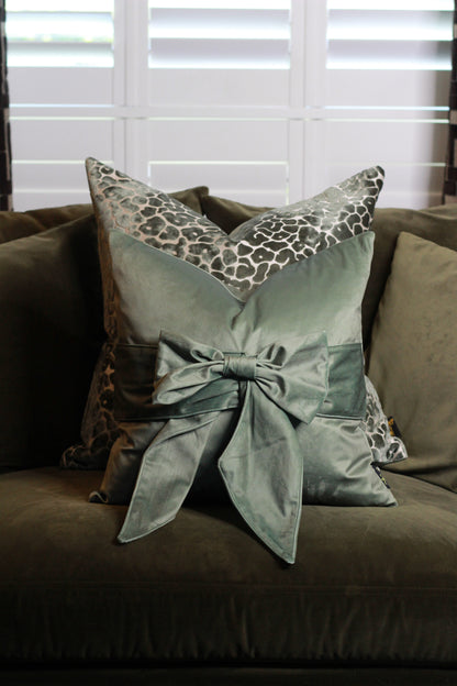 Sage Green Bow Velvet Cushion styled view – Leya Buster Interiors