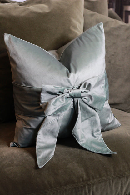 Sage Green Bow Velvet Cushion styled view – Leya Buster Interiors